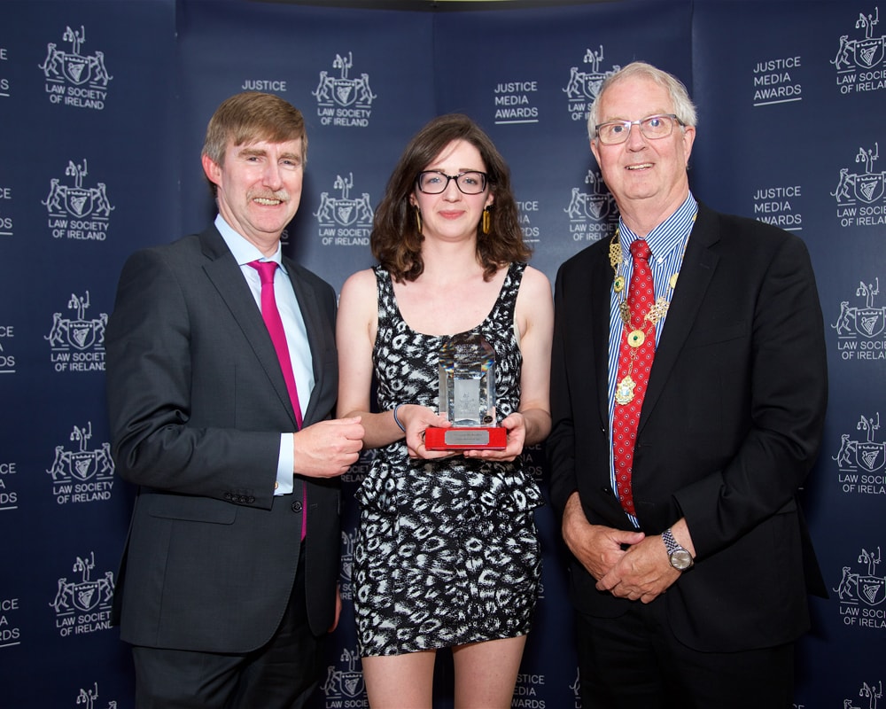 DG Ken Murphy and President Michael Quinlan with Gráinne Ní Aodha of The Journal style=