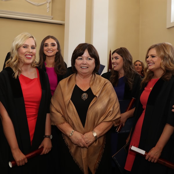 Former Tánaiste Mary Harney surrounded by new solicitors style=