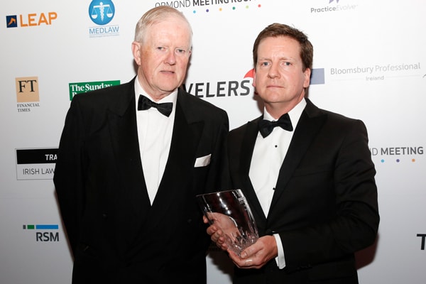 Dr Eamonn Hall, chair of judges, with Cian O’Carroll, recipient of the special merit award style=