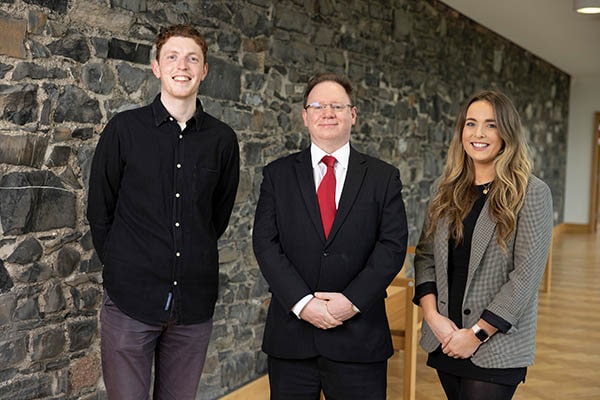 Luke McGivern (A&L Goodbody) and Alannah Short (LK Shields) with Education Committee chair Richard Hammond SC style=