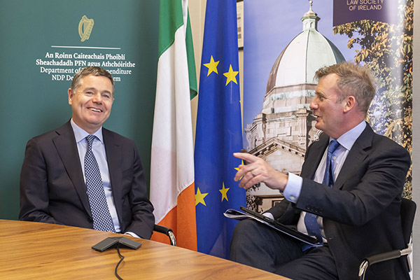 Law Society Director General Mark Garrett in conversation with Finance Minister Paschal Donohue style=